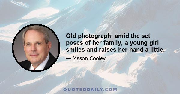 Old photograph: amid the set poses of her family, a young girl smiles and raises her hand a little.